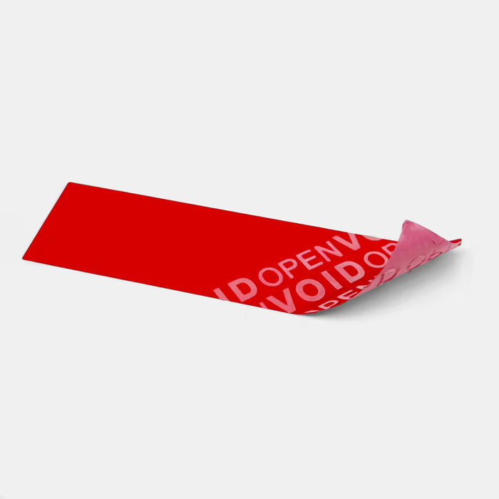 Rotes Non-Transfer-Siegel, teilabgezogen. Sichtbarer ‚OPEN VOID‘-Schriftzug ohne Kleberückstände auf der Oberfläche.